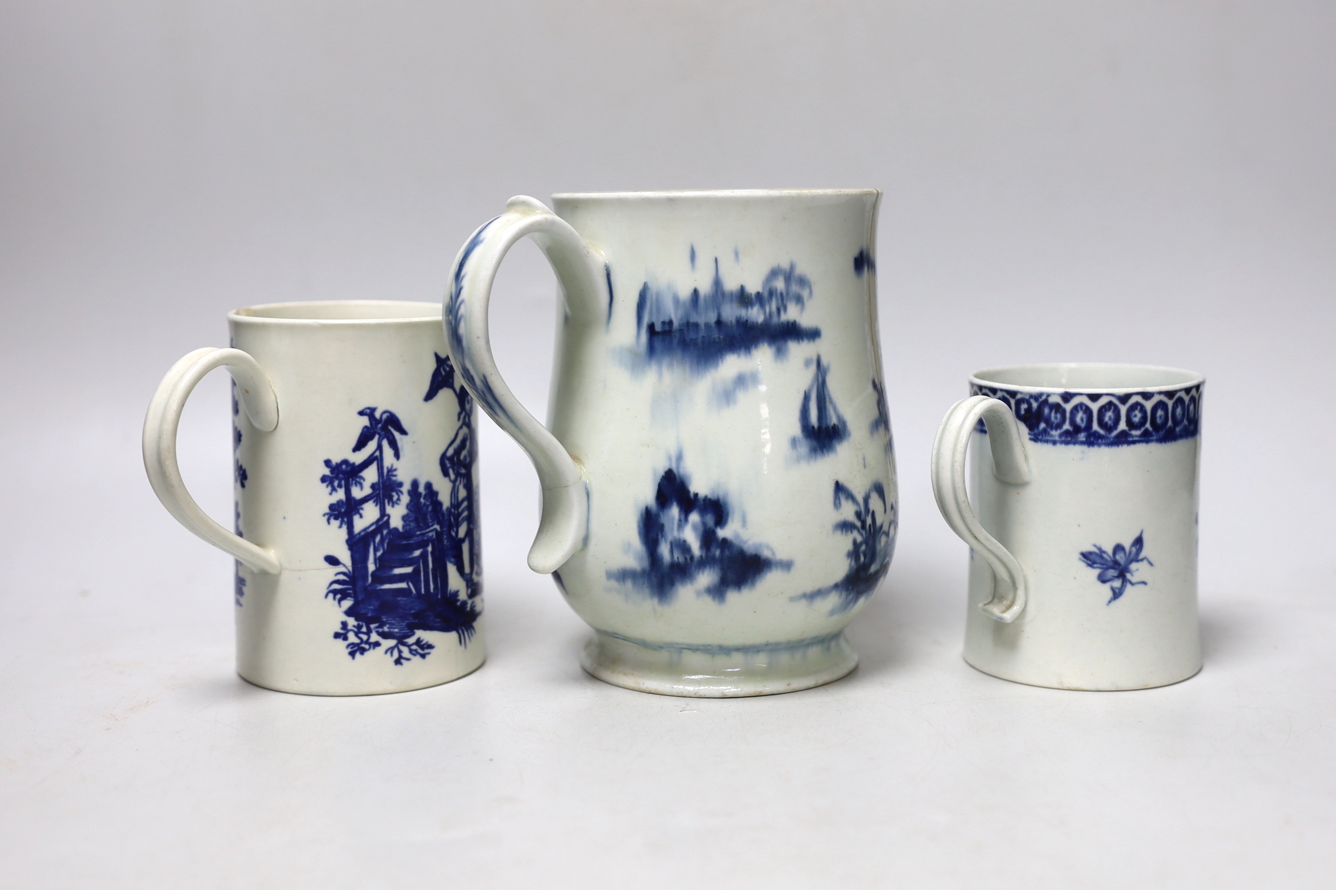 Two late 18th century Worcester blue and white mugs and a Pennington, Liverpool mug, largest 15.5cm high